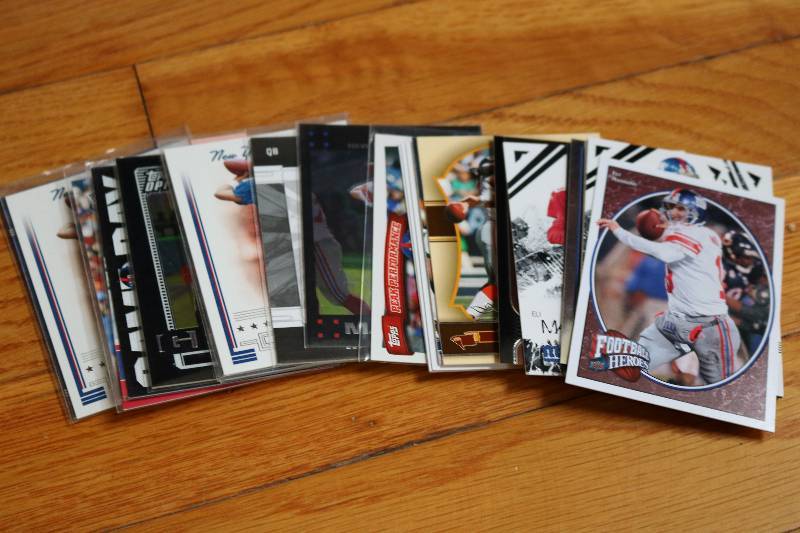 lot 95 image: 25 Eli Manning cards...
