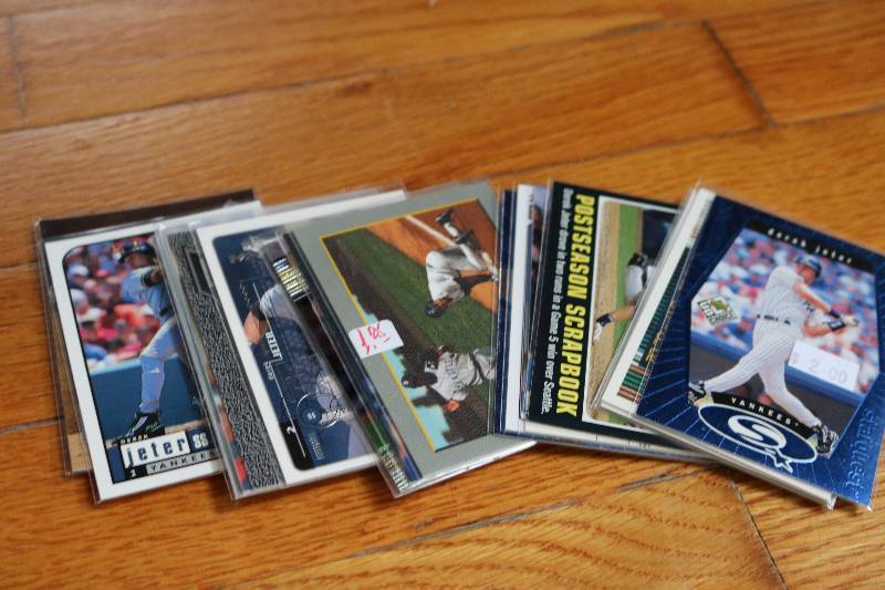 lot 77 image: 20 Derek Jeter crads...