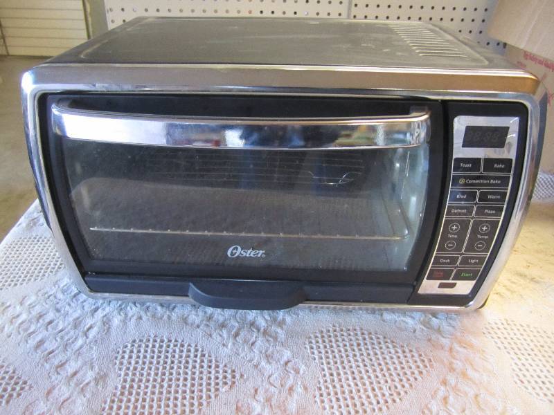 lot 276 image: Oster Toaster Oven Seller says work...