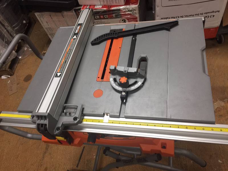 lot 2 image: Ridgid R4513 Table Saw with Stand in like new condition