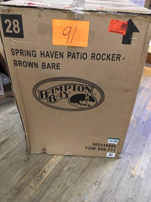 lot 91 image: Spring Haven Brown Wicker Rocking Chair  never used in box MSRP $399