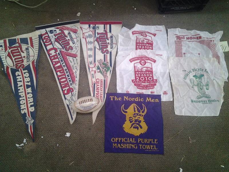 lot 6 image: MN Vikings Onyx Football, Nordic Men Towel, MN Twins Pennants, Homer Hankies