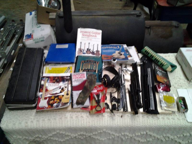 lot 53 image: Lot Of Music Related Books, Stands, Strings, Picks, Head Phones, More
