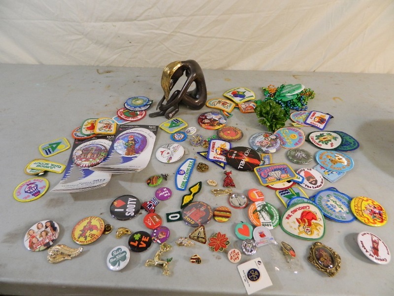 lot 39 image: Metal Figurine, Pins, and Patches