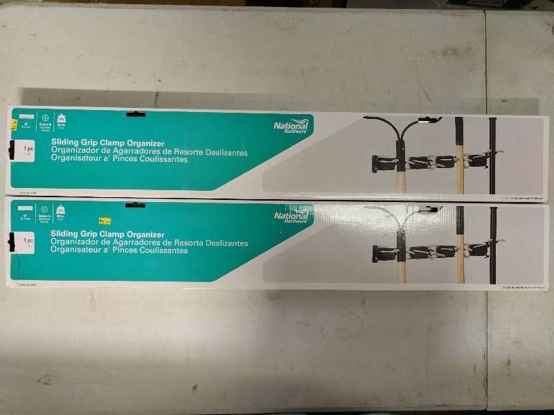 lot 135 image: (2) Sliding Grip Clamp Organizers