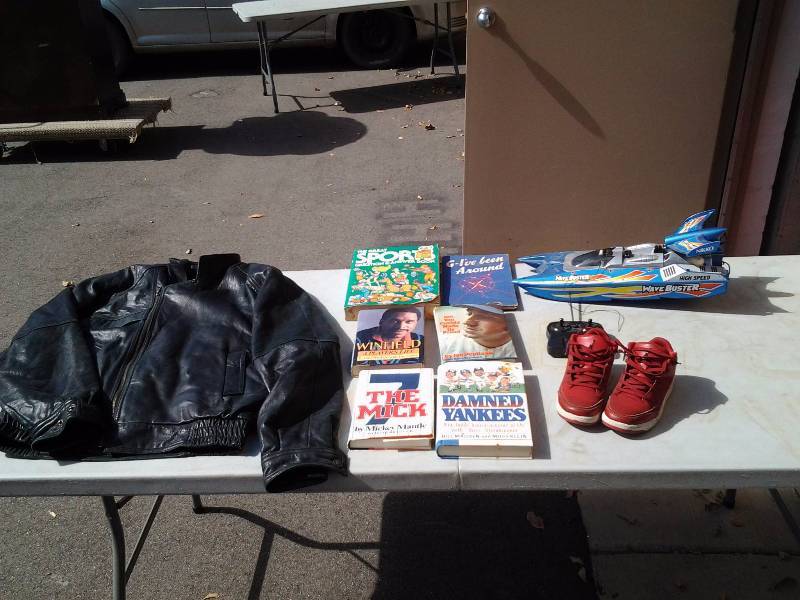lot 16 image: Mens Leather Jacket Size M, Youth Jordan Sneakers-Size 1, Books, Nikko RC Boat