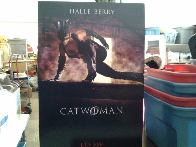 lot 108 image: Halle Berry Catwoman Poster 27x40, Record Albums, 45s, CD-R & DVD-R Discs, Nerf Personal Speaker, Organizer
