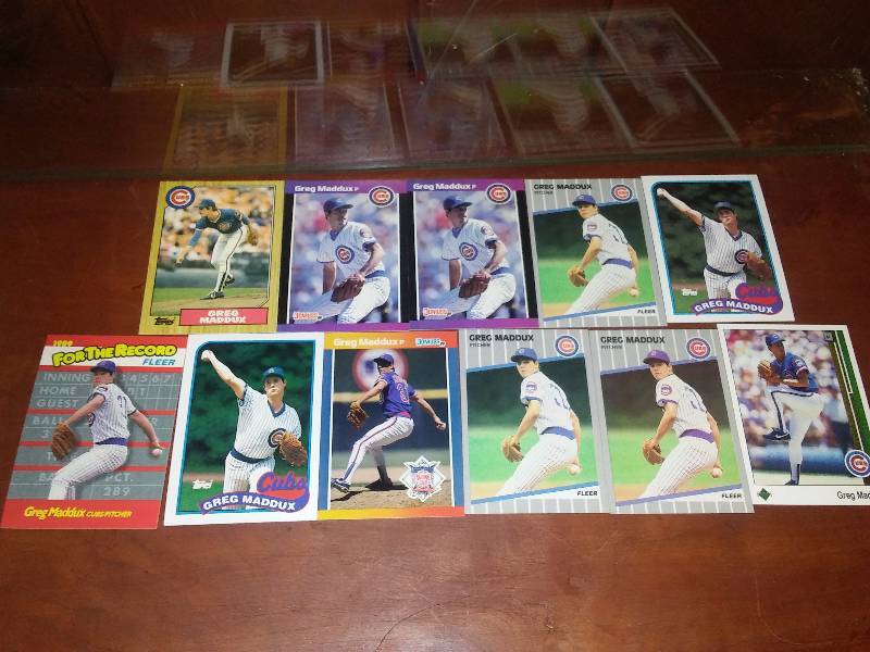 lot 73 image: Greg Maddux Cubs Braves (11 cards)
