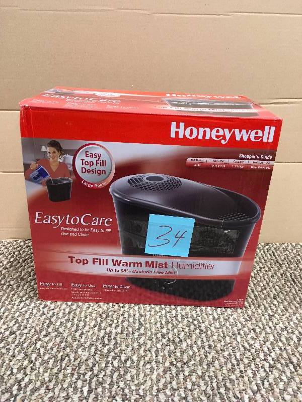 lot 34 image: Honeywell Easy-To-Care Warm Mist Humidifier - Black never used in box
