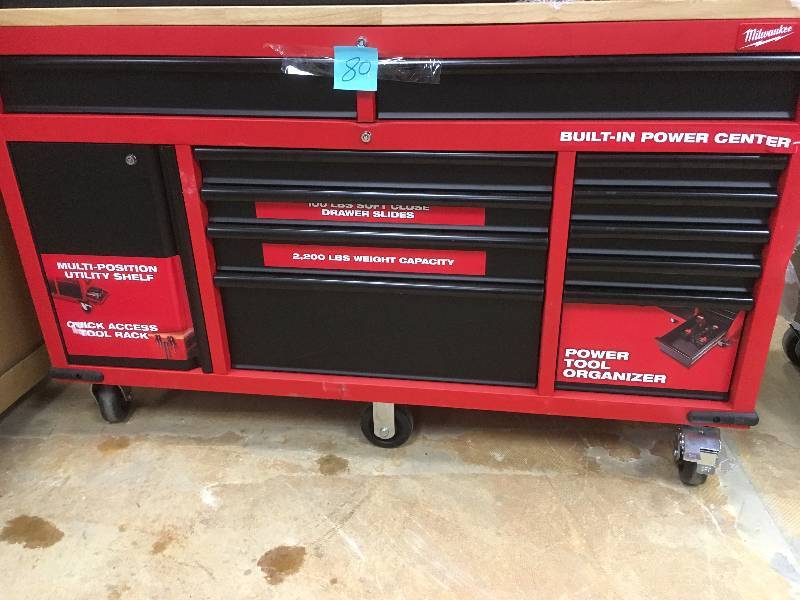 lot 80 image: Milwaukee 60.125 in. 11-Drawer and 1-Door 22 in. D Mobile Workbench with Sliding Pegboard Back Wall, Red and Black good condition MSRP $699