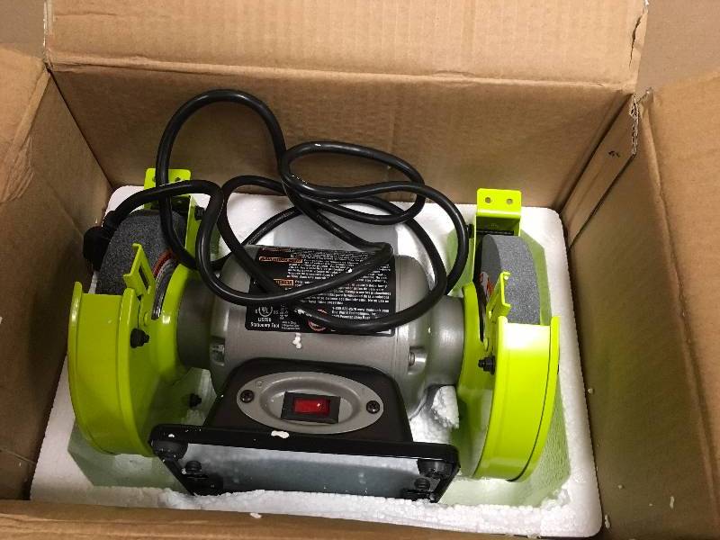lot 110 image: Bench Grinders Ryobi Grinders 6 in. Grinder with LED Lights BG612G missing gaurd and or stop rest in box working good condition