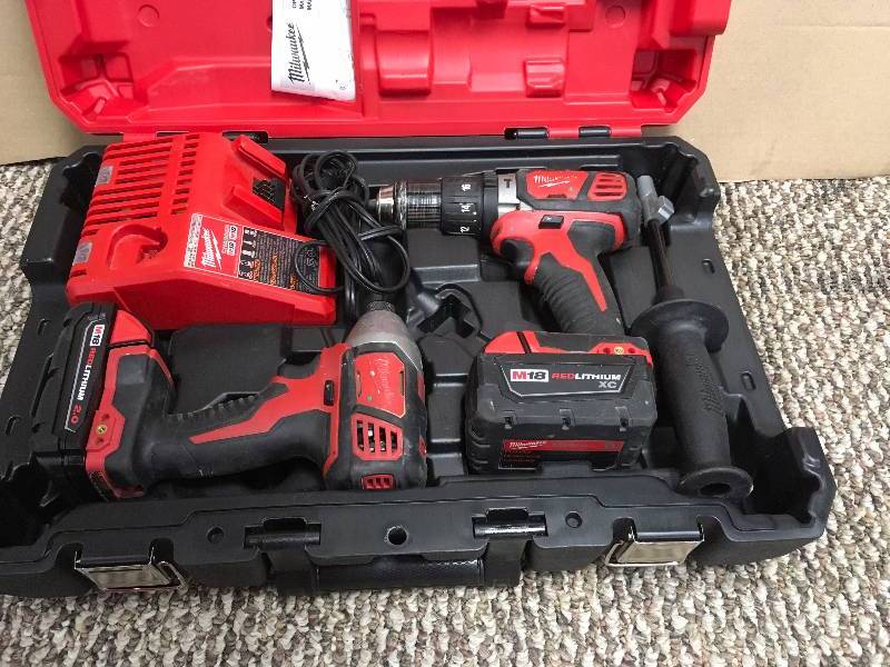 lot 112 image: Milwaukee 2897-22cx M18 Fuel 18v Li-ion Hammer Drillimpact Driver in box good working condition with batteries and charger