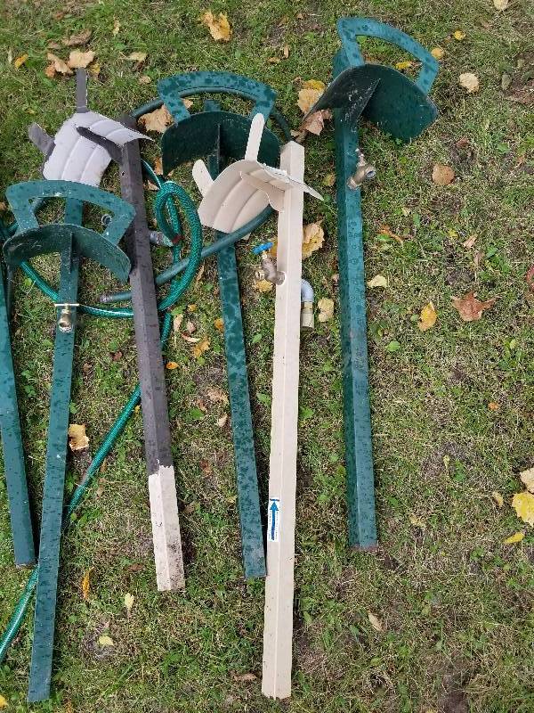 lot 94 image: Lot - Metal Garden Hose Holders, Some with Spickets