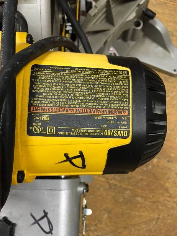 lot 117 image: DEWALT 15 Amp 12 in. Double Bevel Sliding Compound Miter Saw good condition working MSRP $599