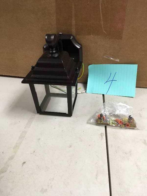 lot 4 image: Brinks Activated Security Lantern missing 1 side glass