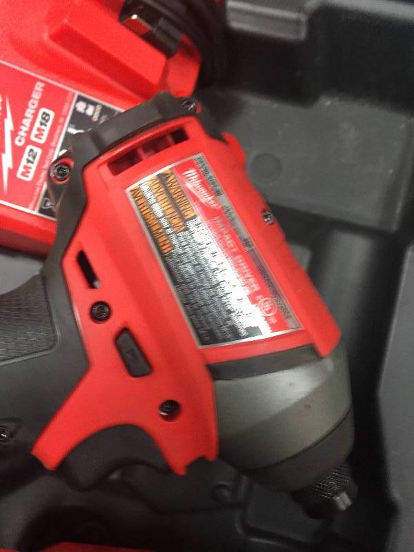 lot 36 image: Milwaukee 2 Tool 2757-20 Impact 2706-20 Drill Driver Set WCharger used in very good condition