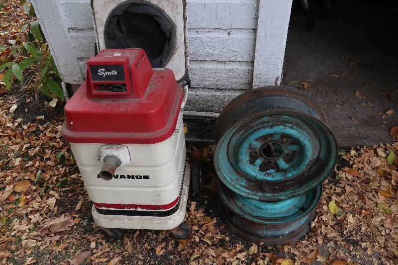 OLD SPRITE SHOP VAC AND TWO TIRE RIMS