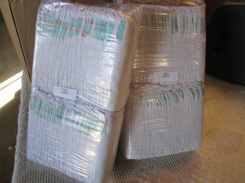 lot 65 image: Lot of 100 Diapers 2 packs of 50 ea...
