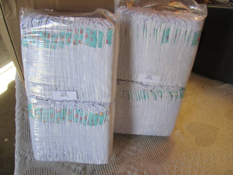 lot 67 image: Lot of 100 Diapers 2 packs of 50 ea...