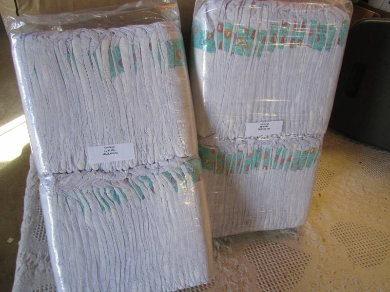 lot 68 image: Lot of 100 Diapers 2 packs of 50 ea...