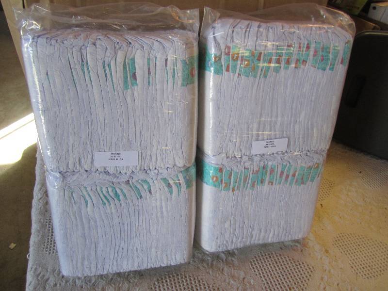 lot 69 image: Lot of 100 Diapers 2 packs of 50 ea...