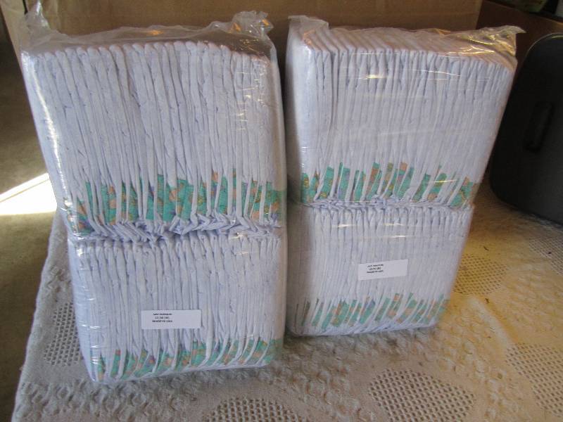 lot 74 image: Lot of 100 Diapers 2 packs of 50 ea...