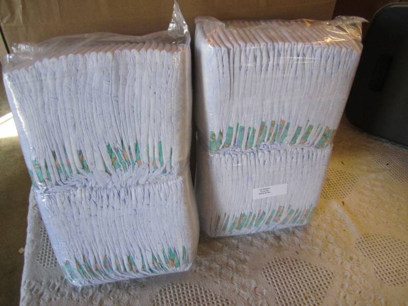 lot 75 image: Lot of 100 Diapers 2 packs of 50 ea...