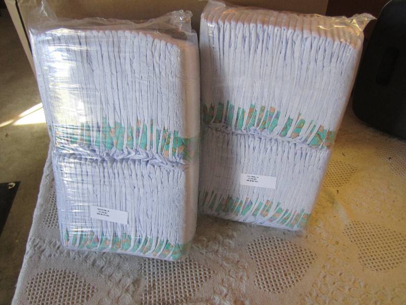 lot 76 image: Lot of 100 Diapers 2 packs of 50 ea...