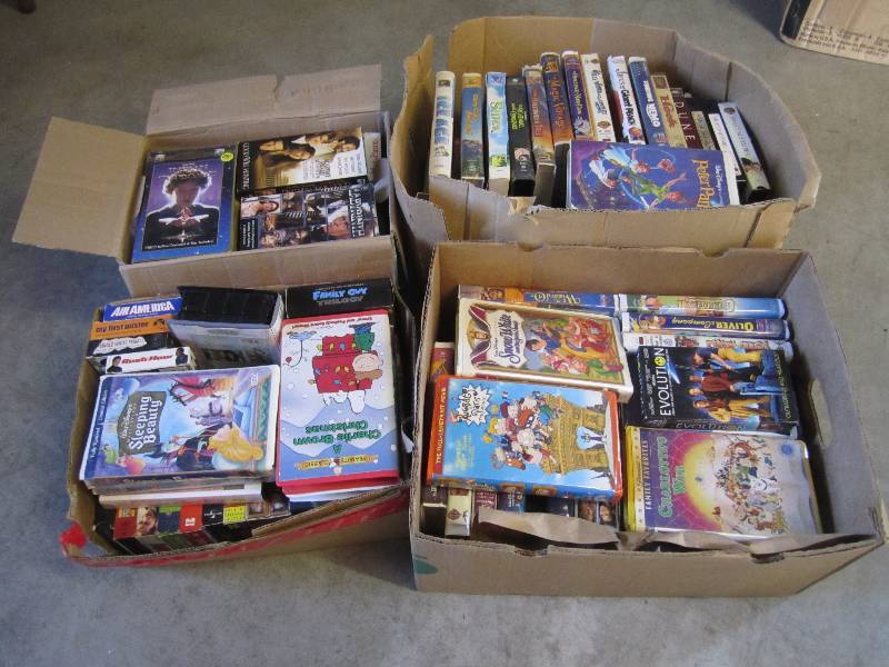 lot 216 image: Lot of 4 Boxes Full of VHS Movies. ...