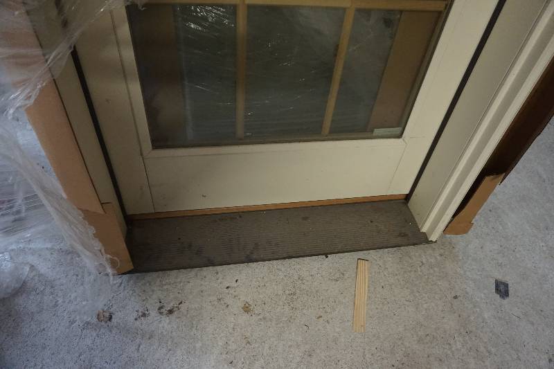 lot 42 image: Pella Designer Series Exterior Entry Door With Wood Grille and Frame