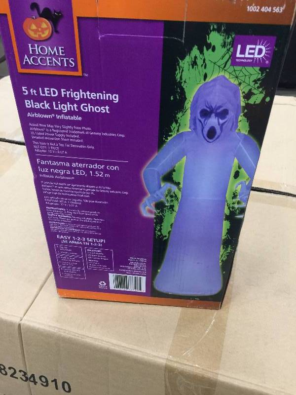 lot 9 image: 5 ft. Inflatable Frightened Ghost MD Black Light