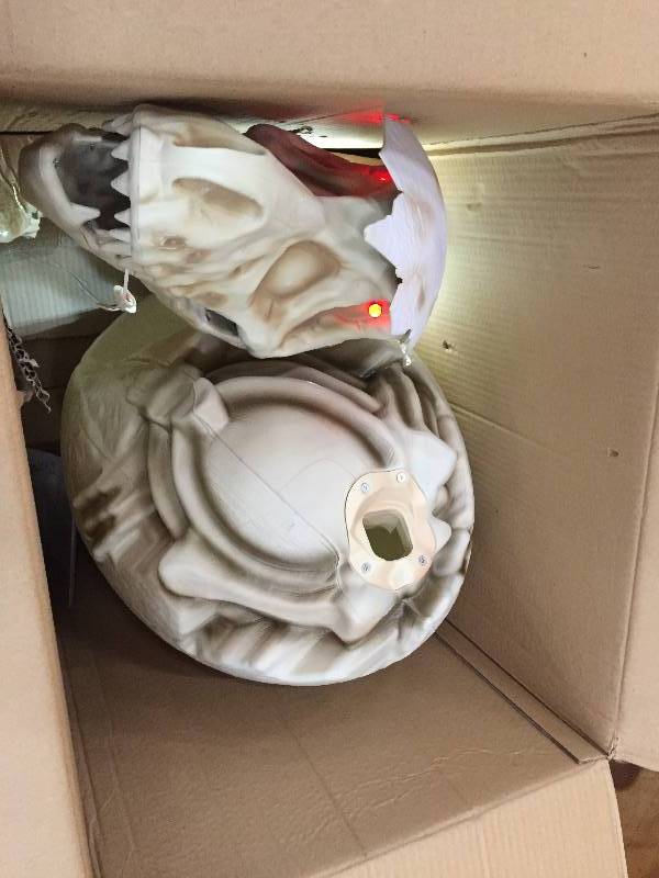 lot 19 image: 36 in. Animated Hatching T-Rex Egg with LED Illumination
