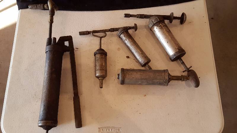 lot 115 image: Vintage Grease Guns