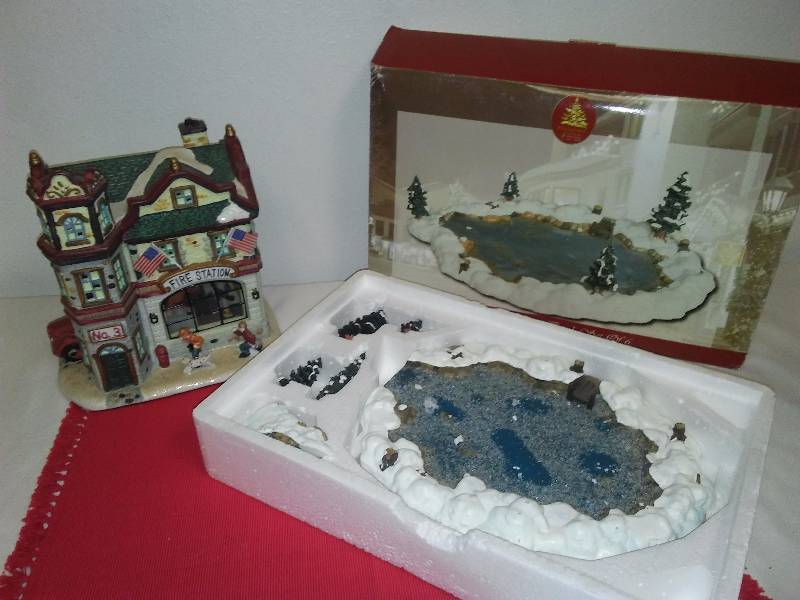 lot 156 image: Enchanted Christmas Village Pieces (2)