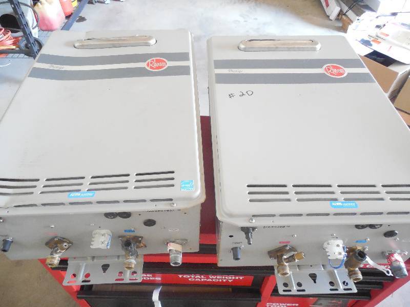 (2) RHEEM NATURAL GAS 199,000 BTU TANK-LESS HOT WATER HEATERS