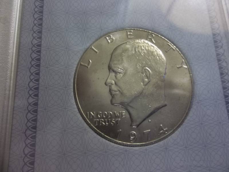 1974 D Ike Dollar Uncirculated Graded In AACGS Holder MS63