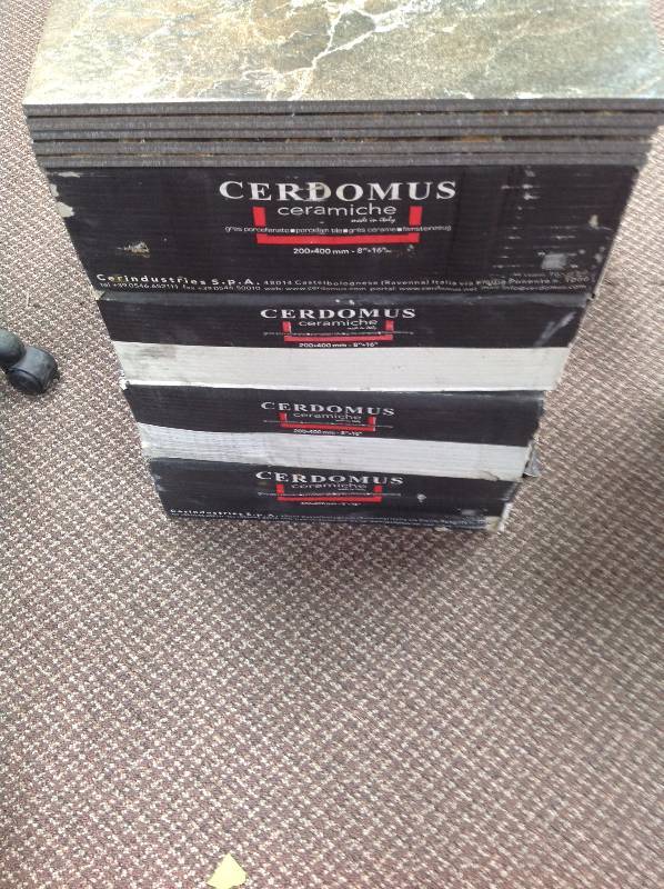 lot 34 image: Cerdomus Tiles  Four boxes with five extra tiles