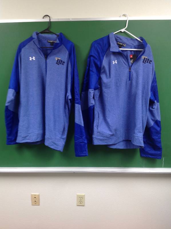 lot 42 image: Miller Light, Under Armour One With Tags, Two Light and Dark Blue 3XL 14 Zip Up Sweatshirts