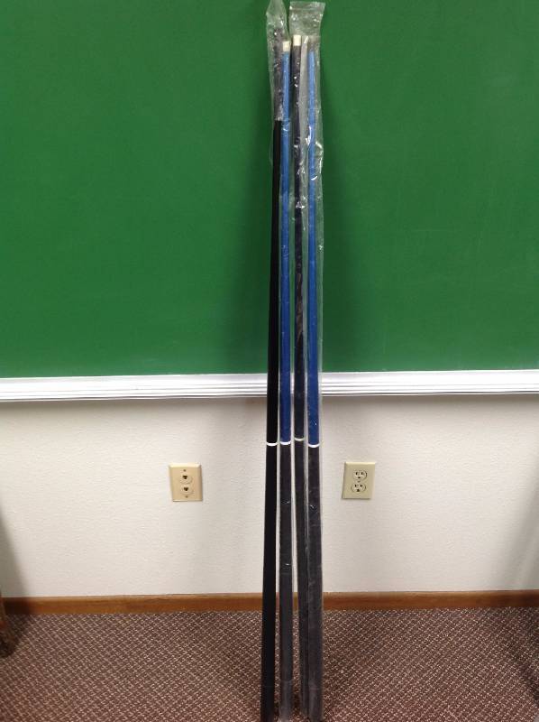 lot 67 image: Four Pool Sticks