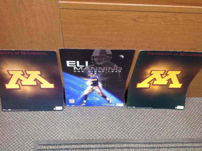 lot 111 image: Three Posters, Two MSUM and One Eli Manning