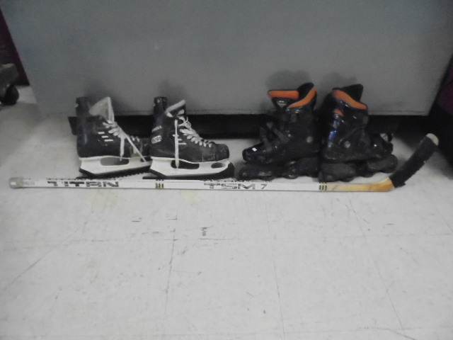 lot 14 image: Roller Blades, Ice Skates, And Hockey Stick