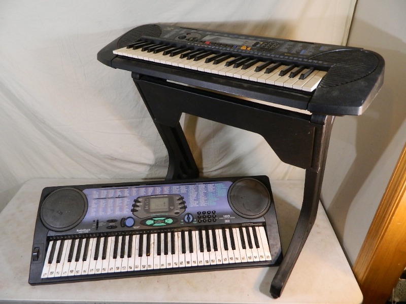 lot 107 image: 2 Keyboards and Stand