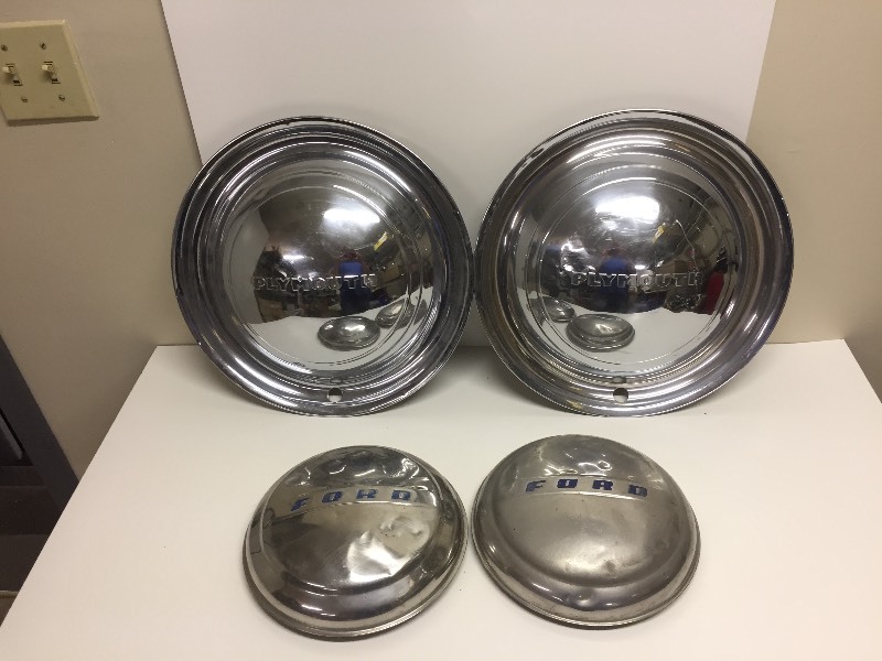 lot 106 image: Vintage Ford & Plymouth Hubcaps
