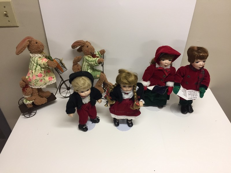 lot 111 image: Porcelain Holiday Dolls & Bunnies on bikes