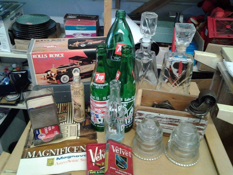 Lot Of Collectibles Tobacco Tins, Glass Insulators, Bottles & Decanters, Casters, Rolls Royce Radio