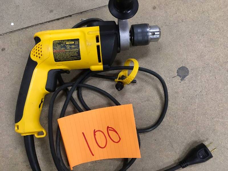 lot 100 image: Dewalt 12 in. Variable Speed Reversible Hammer Drill model # DW511 used in working condition