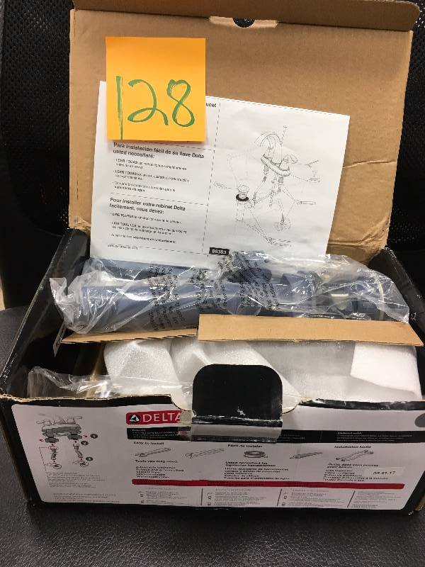 lot 128 image: Delta Zella 4in. Ceterset2-handle bathroom faucet in chrome (grey) in working condition