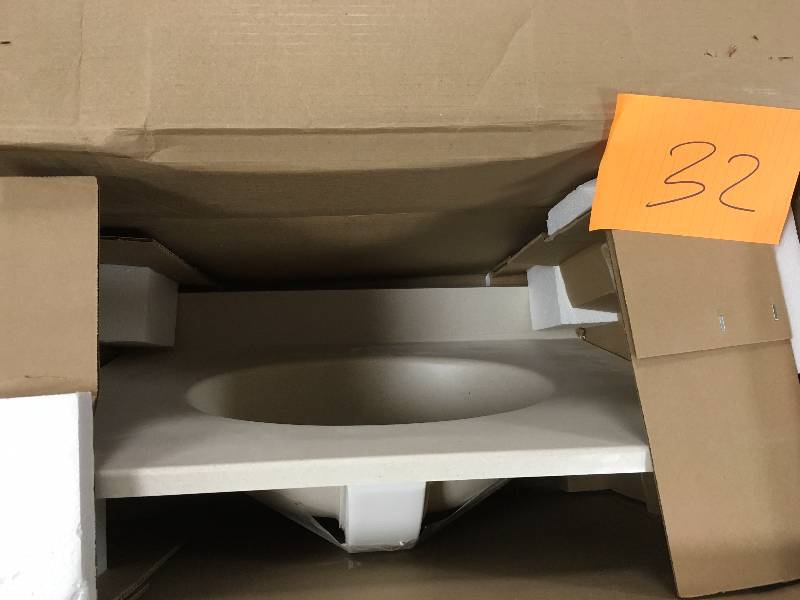lot 32 image: Swanstone VT1B1925 Ellipse One Piece Vanity Top and Sink 19 D x 25 W Tahiti Sand Fixture Vanity Top Swanstone never used in box MSRP $214