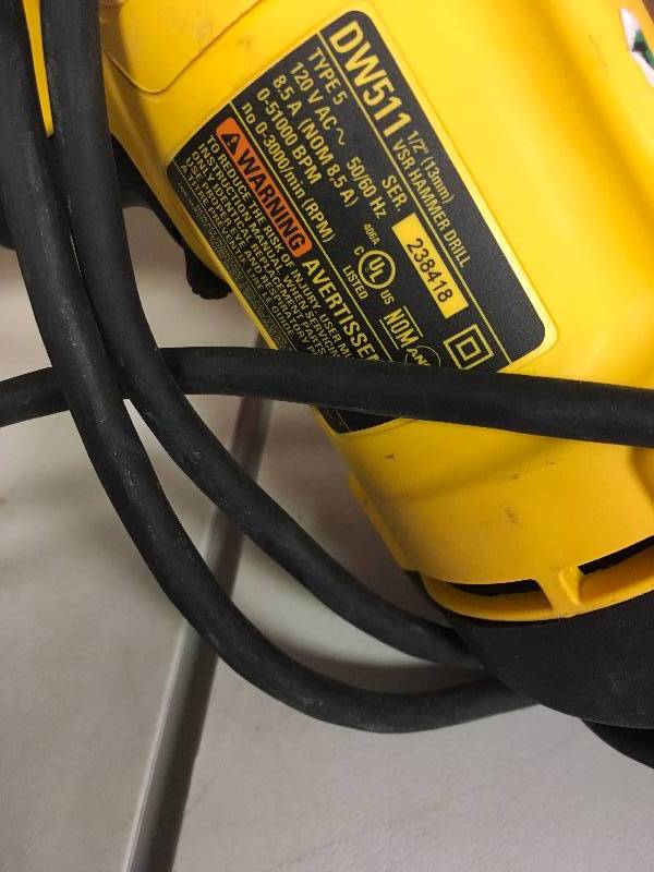 lot 18 image: Dewalt 12 in. Variable Speed Reversible Hammer Drill used in working condition
