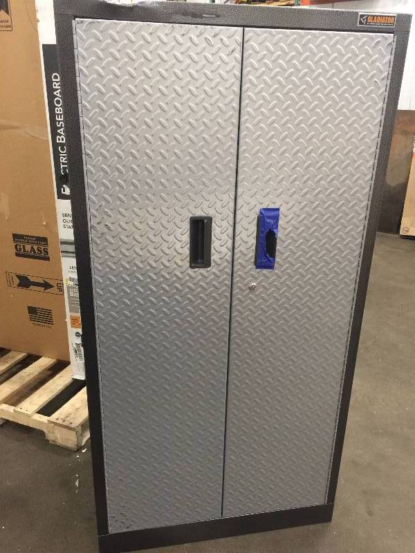lot 14 image: Gladiator Premier Series Pre-Assembled 66 in. H x 30 in. W x 18 in. D Steel Rolling Garage Cabinet in Silver Tread open box never used whit small damage on the top